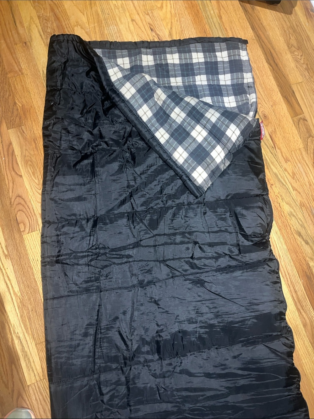 Coleman Black Sleeping Bag with Gray Plaid Lining